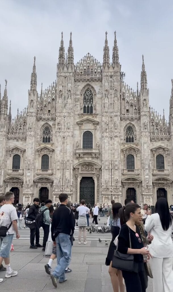 Crowds of tourists in Piazza del Duomo in front of the Milan Cathedral, Italy